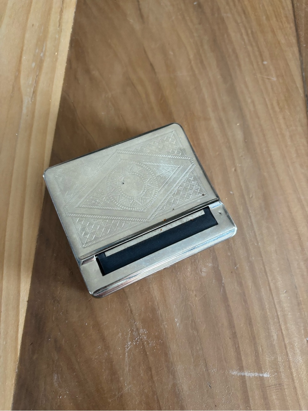 Portable cigarette rolling machine.
